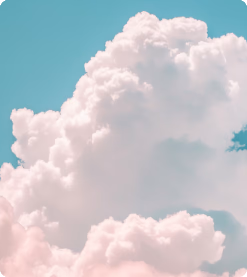 Large fluffy white clouds against a bright blue sky with rounded corners.