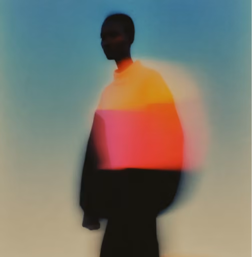 Blurred silhouette of a person with colorful light streaks against a gradient blue background.
