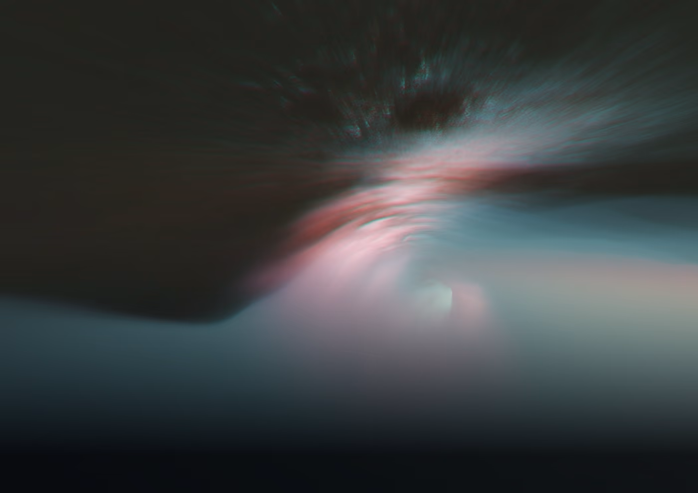 Abstract image with dark and blurred light streaks creating a tunnel effect in muted colors.