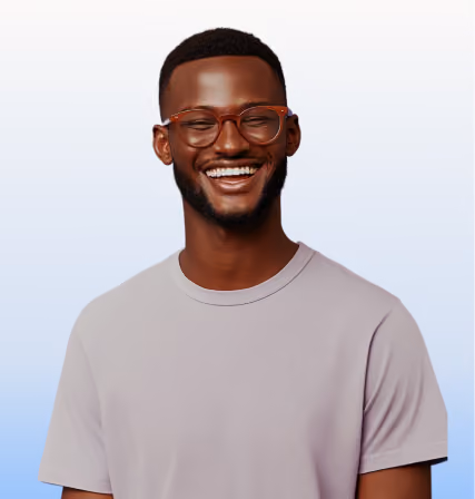 Smiling man with glasses and beard wearing a light gray t-shirt against a light background.