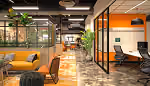 Modern open office with orange couches and workstations under industrial ceilings and plants.