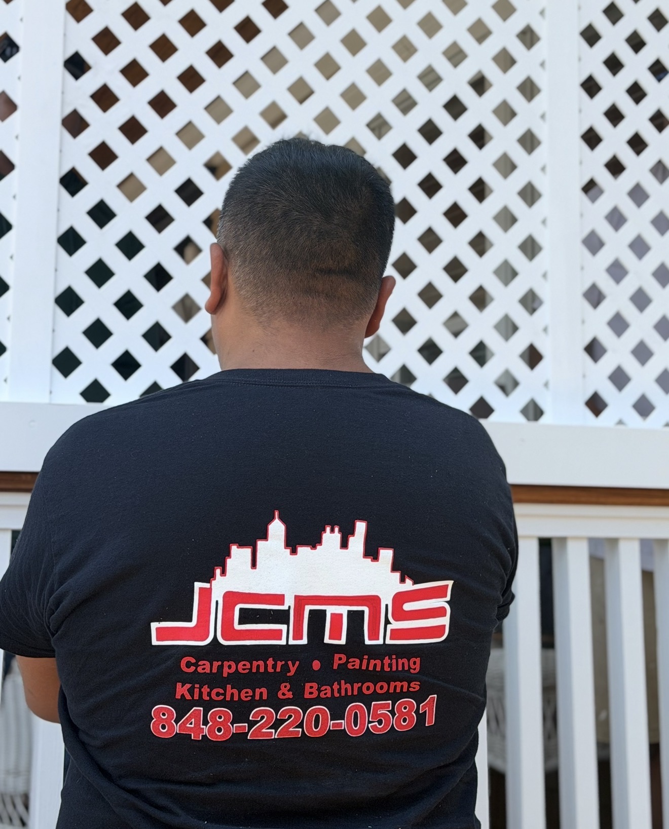 image of team in front of company building (for a roofing contractor)