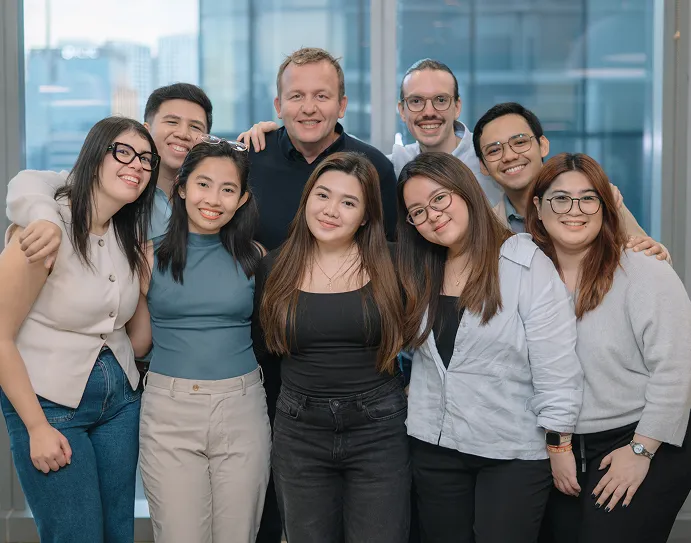 Diverse team of professionals gathered together, representing a high-performing tech team