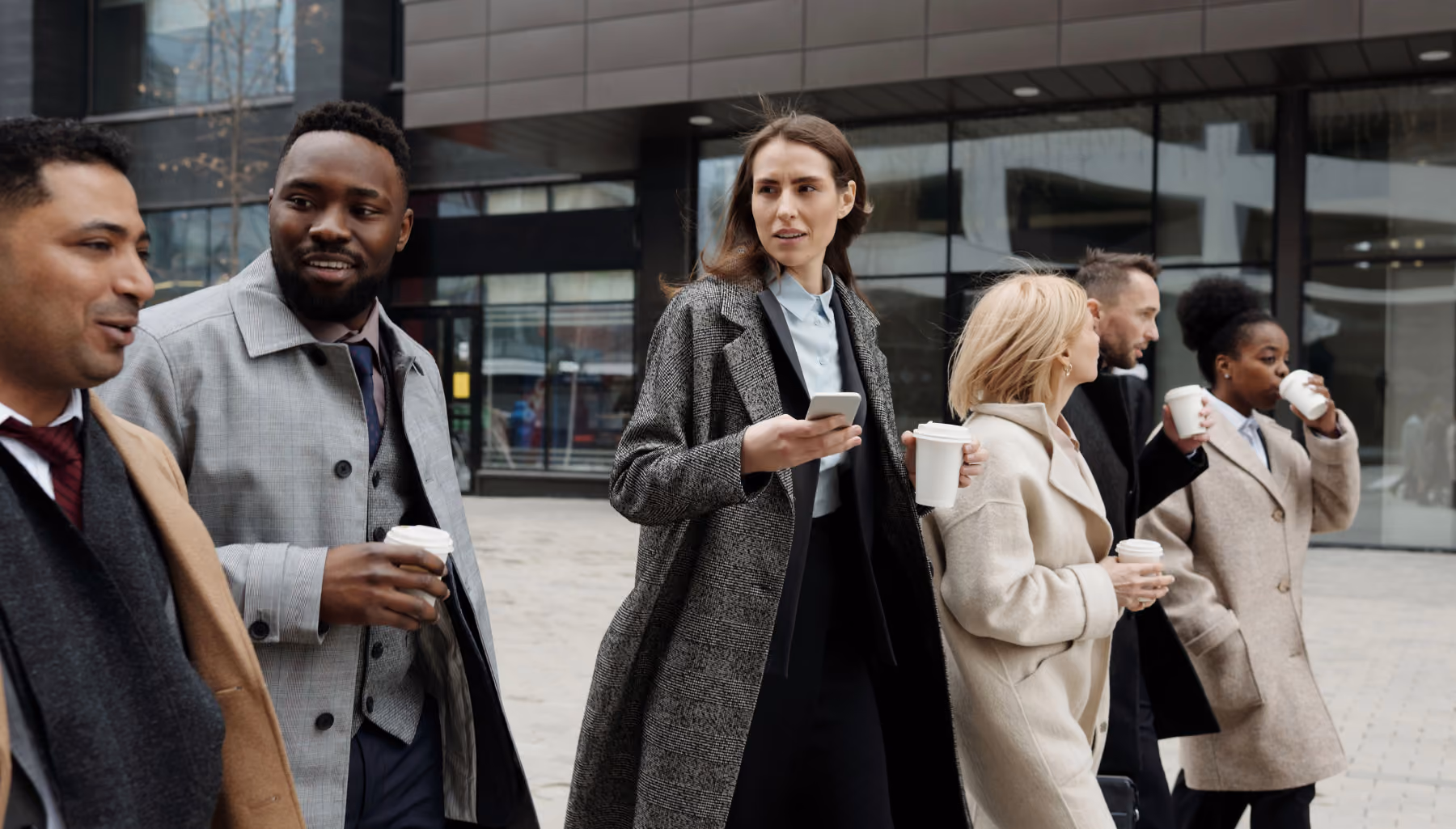 Leaders and employees walking together with confidence