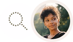 Magnifying glass icon next to a young woman with curly hair looking to the side outdoors.