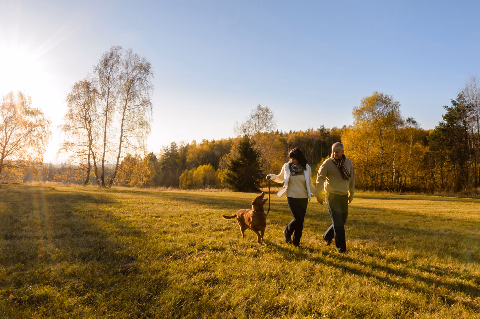 Man and woman walking dog in upper moor pershore