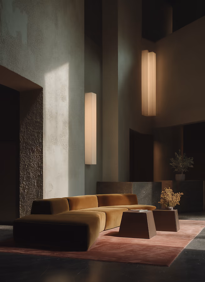 Modern interior with warm wood floating staircase, concrete walls, large window, and gray sofa below.