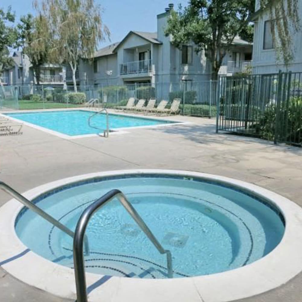Hot tub near swimming pool