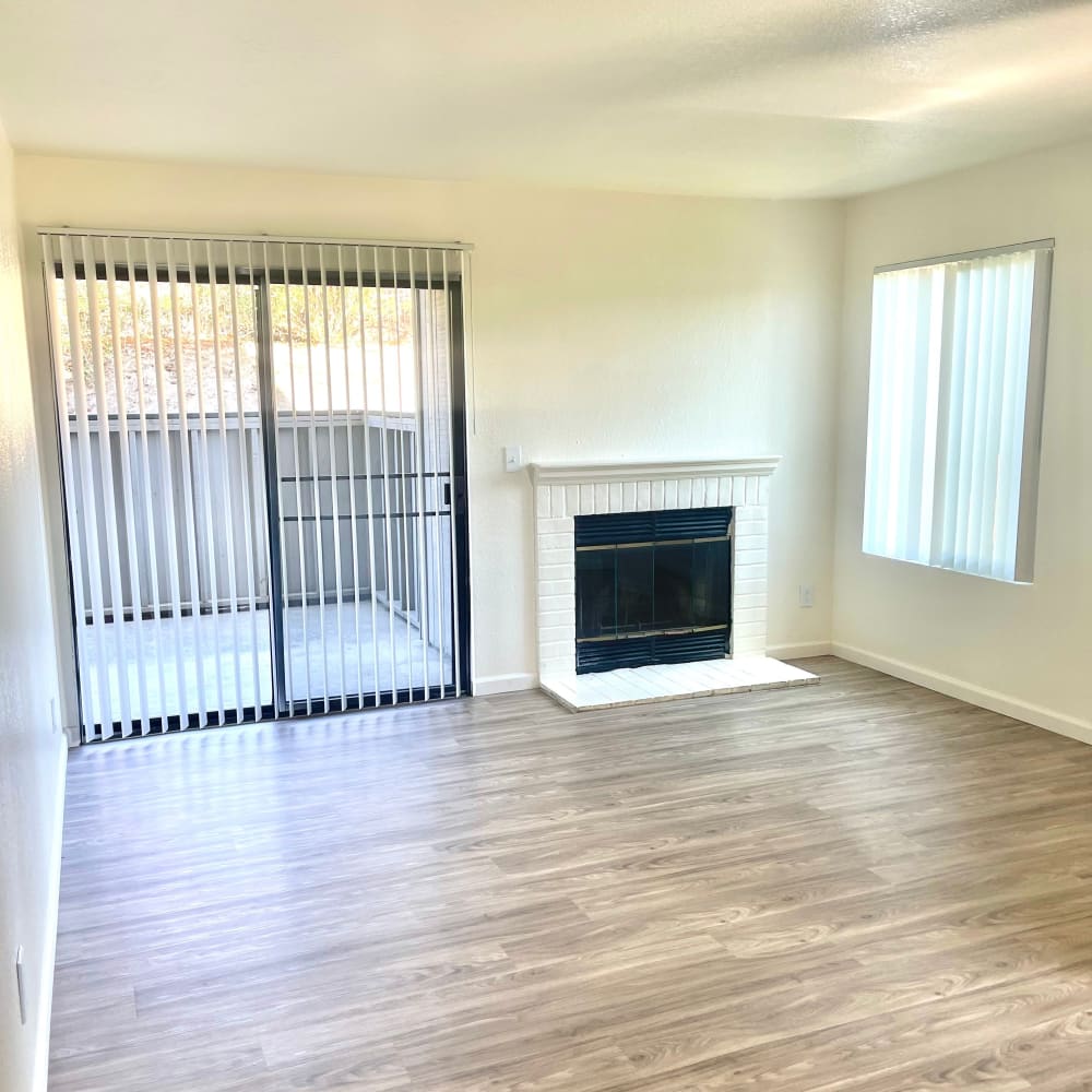 Unfurnished living area with fire place