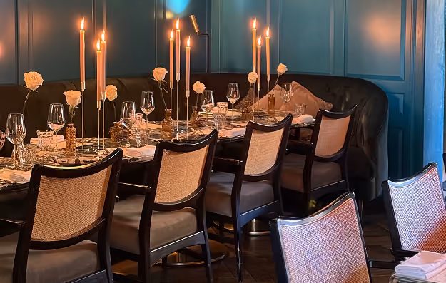 A candlelit private dining table at The Grayson