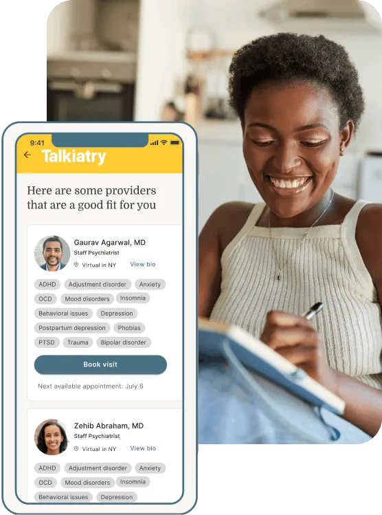 Woman smiling while writing in a notebook beside a mobile screen showing matched mental health providers