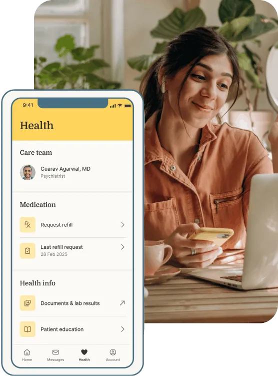 Woman smiling while writing in a notebook beside a mobile screen showing matched mental health providers