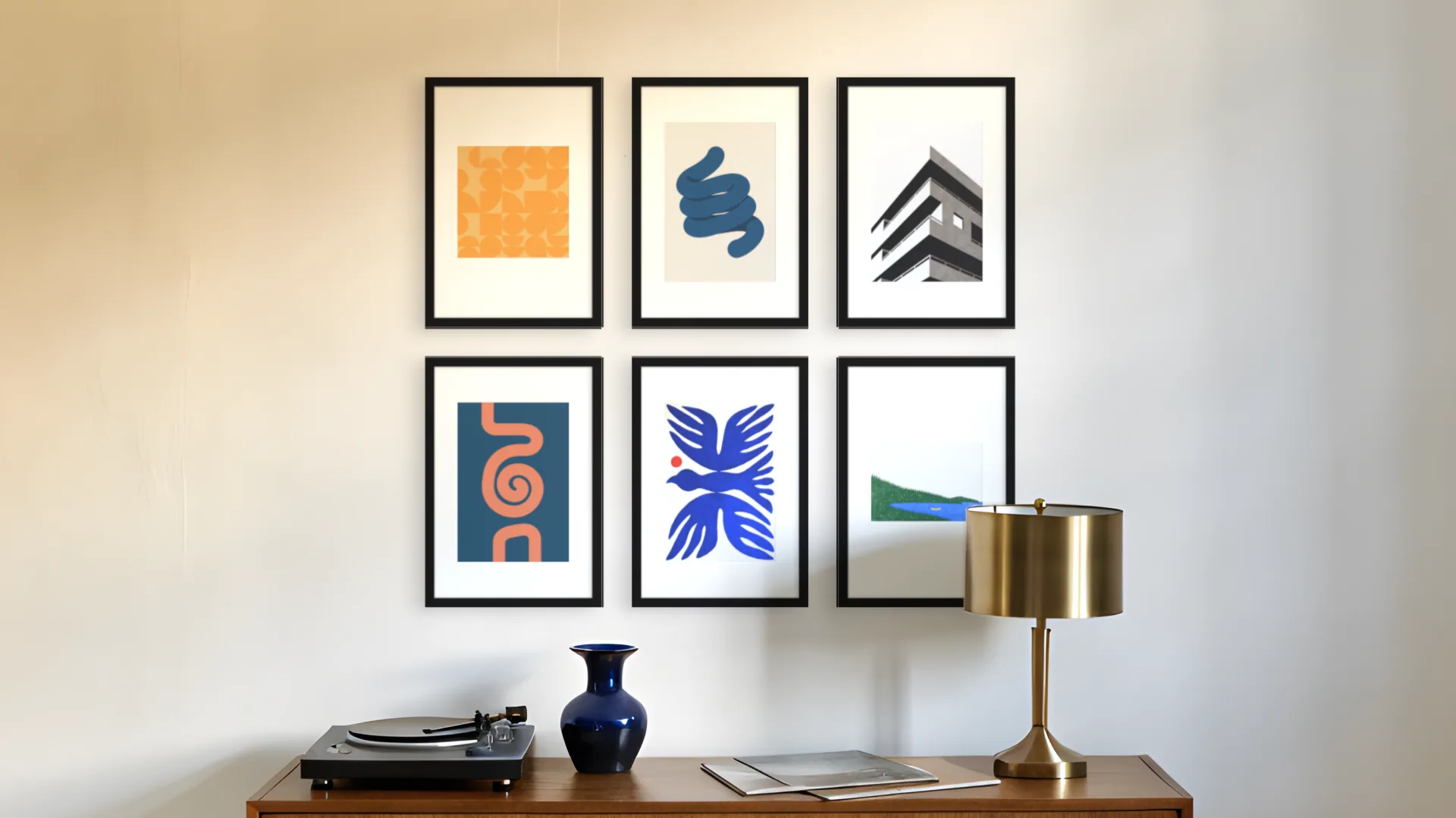 Mid-century gallery wall idea: six prints in black frames in a two by three grid above a sideboard in a living room