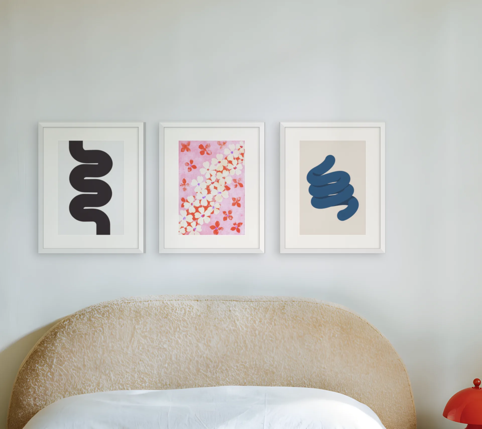 Minimal gallery wall template: three prints in a row above a bed in a bedroom