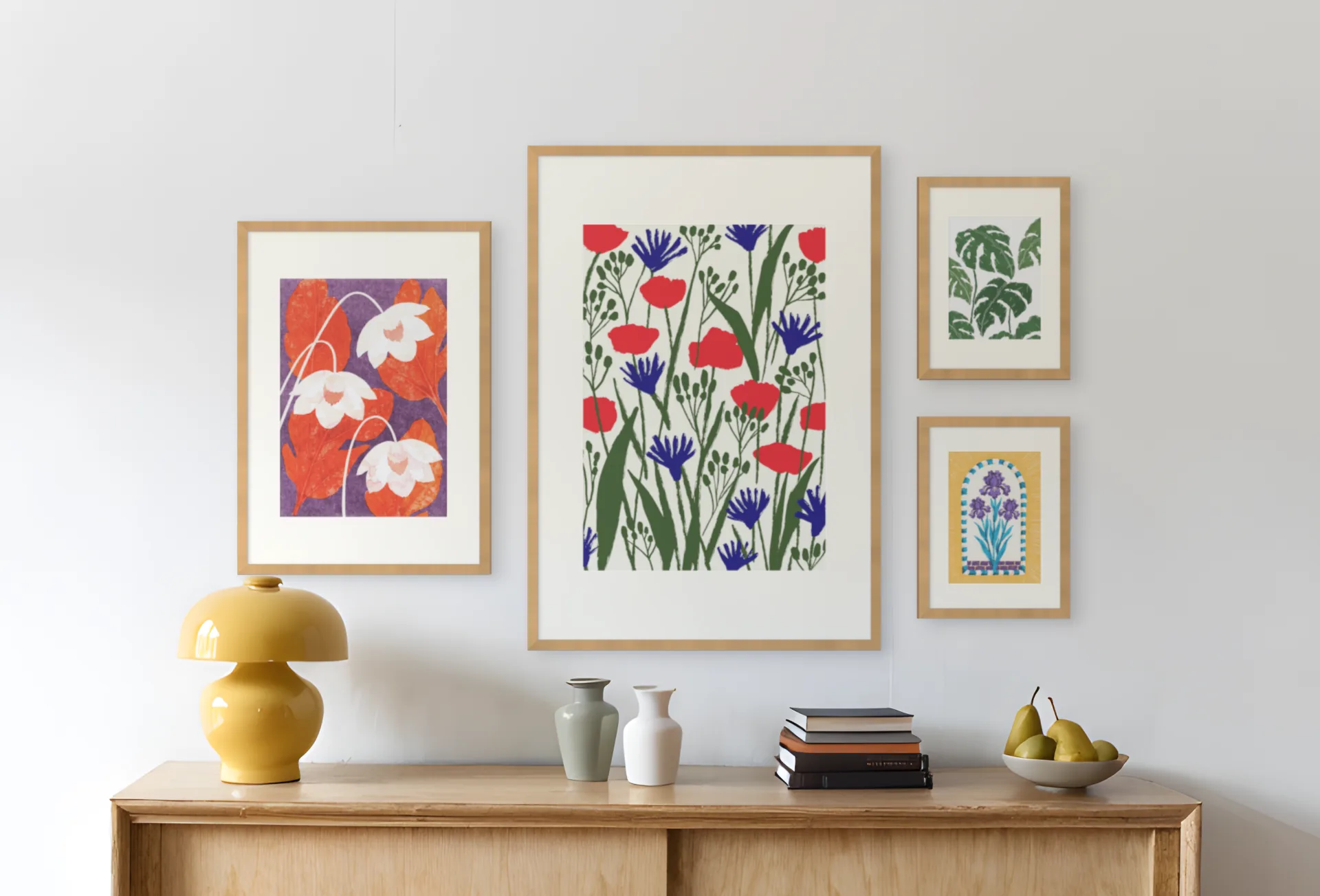 A four frame gallery wall template on a photo of a living room wall, above a sideboard