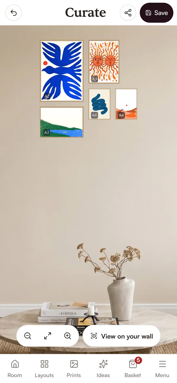 The same five prints arranged in the Curate planner on a phone