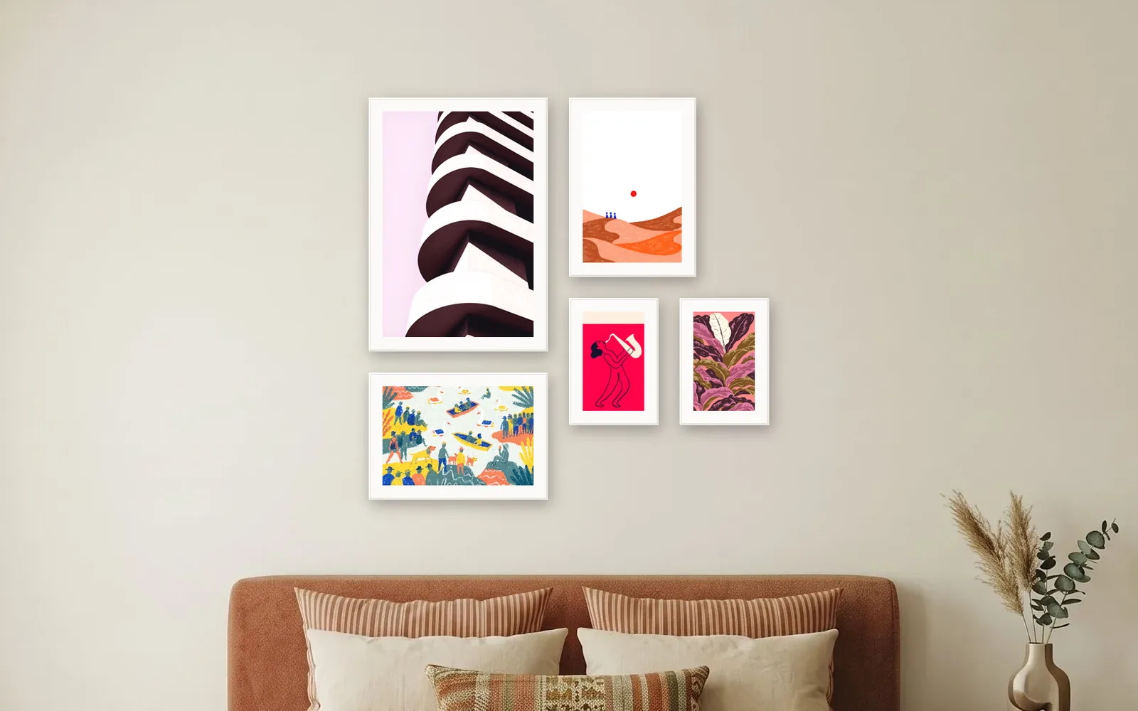 Asymmetric gallery wall layout: five prints in white frames, off-centre above a bed