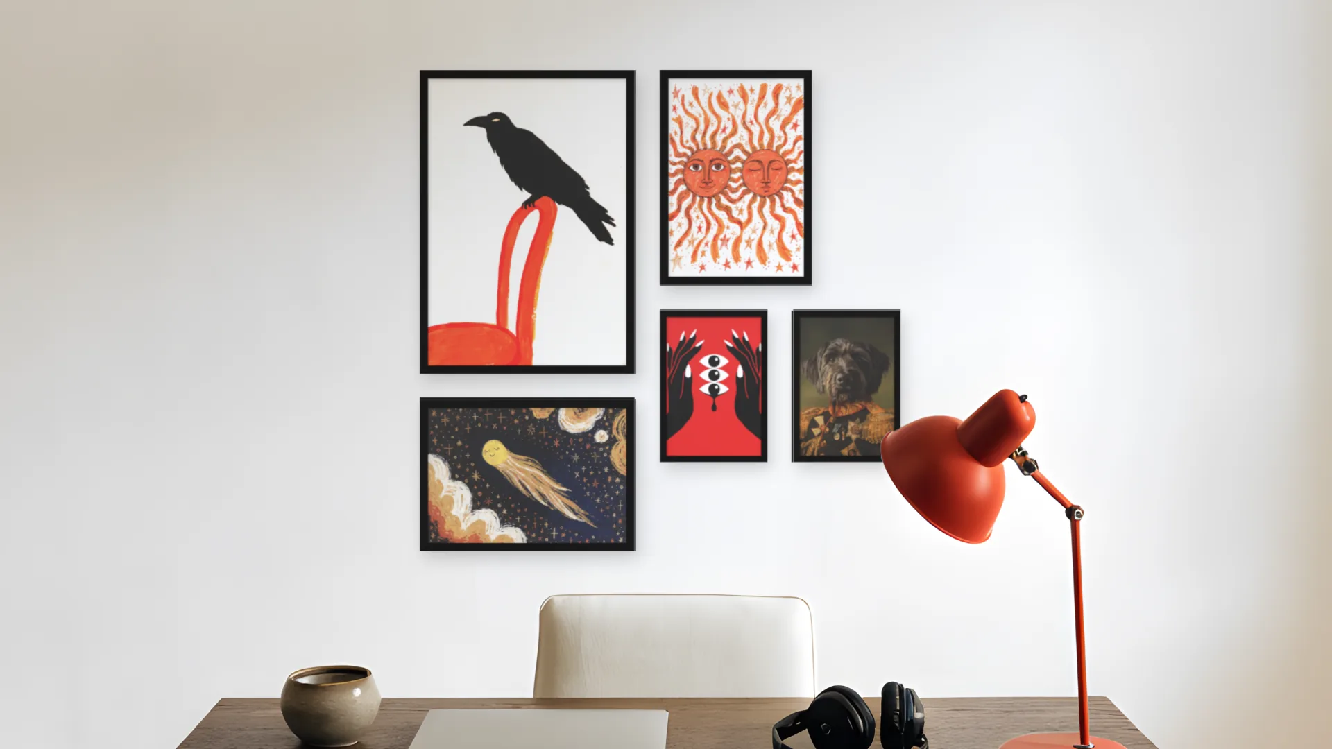 Surrealist gallery wall idea: five prints in black frames in an asymmetric layout above a desk in a home office.