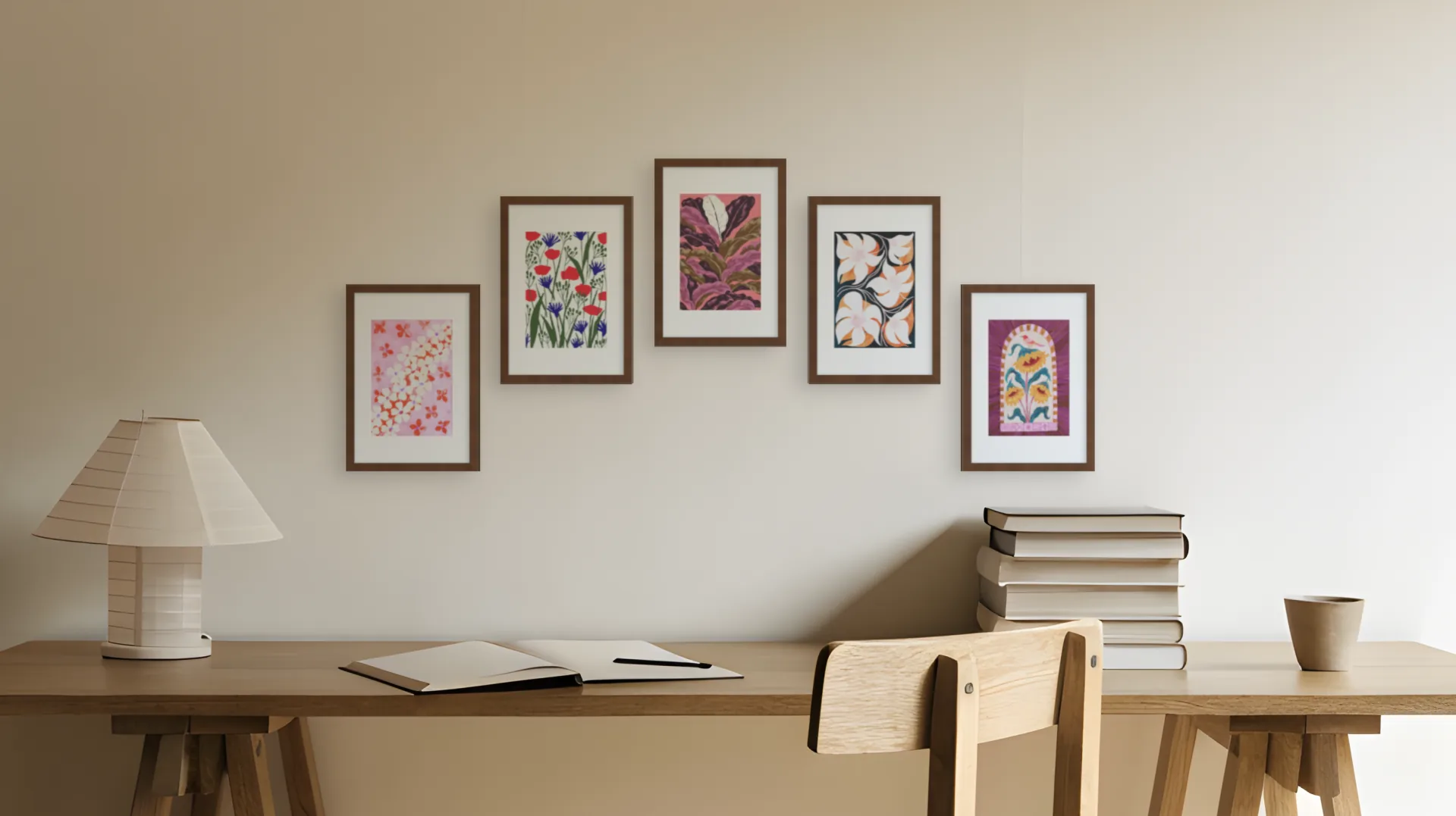 Art Nouveau gallery wall idea: five prints in walnut frames in an arch layout above a desk in a home office.
