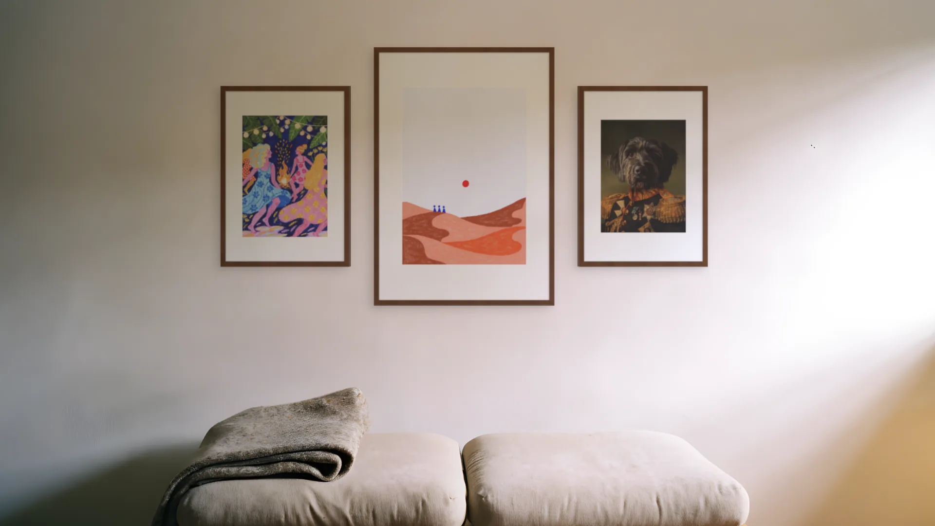 Impressionist gallery wall idea: three prints in walnut frames in a hero trio layout above a bench in a reading nook.