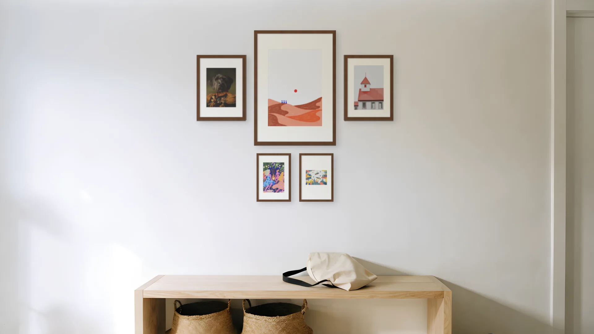 Traditional gallery wall idea: five prints in walnut frames in a symmetric layout above a bench in a hallway.
