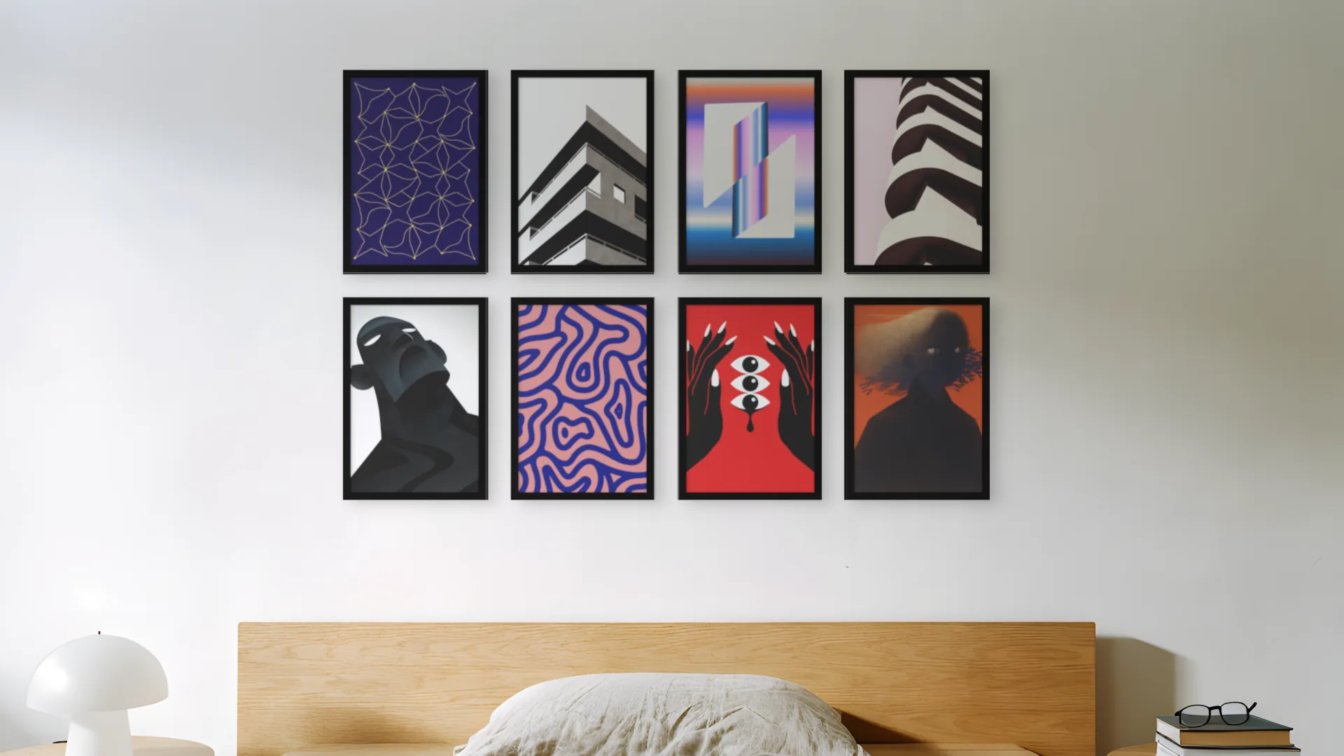Industrial gallery wall idea: eight prints in black frames in a gallery layout above a bed in a bedroom.