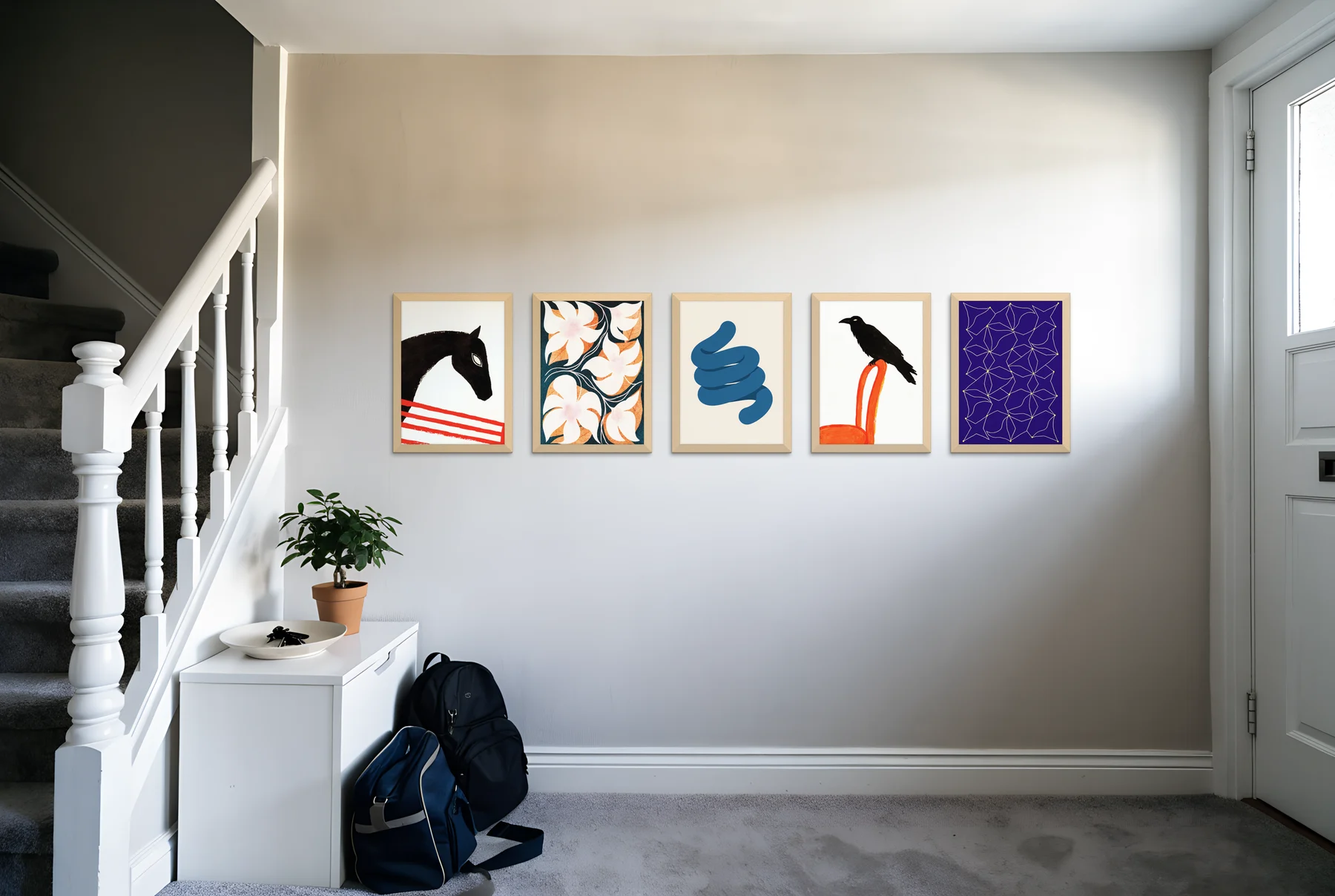 A row of five evenly spaced light oak frames in a bright hallway