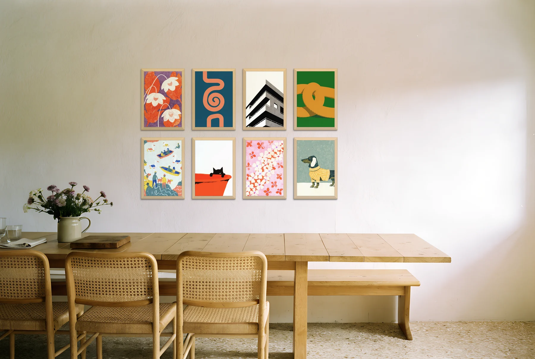 A calm, evenly spaced gallery of eight light oak frames above a long dining table