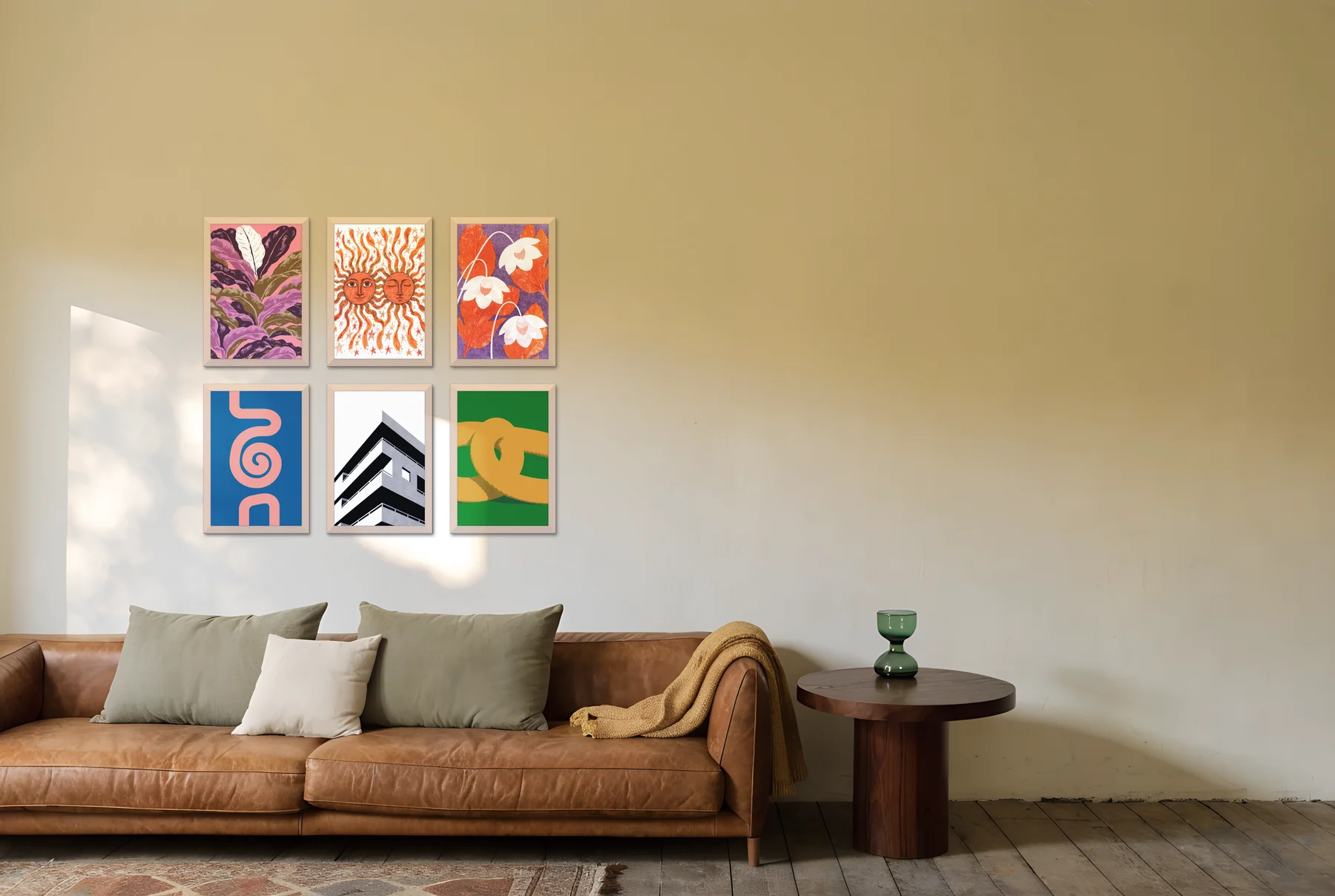 A six-frame grid of colourful prints above a tan leather sofa