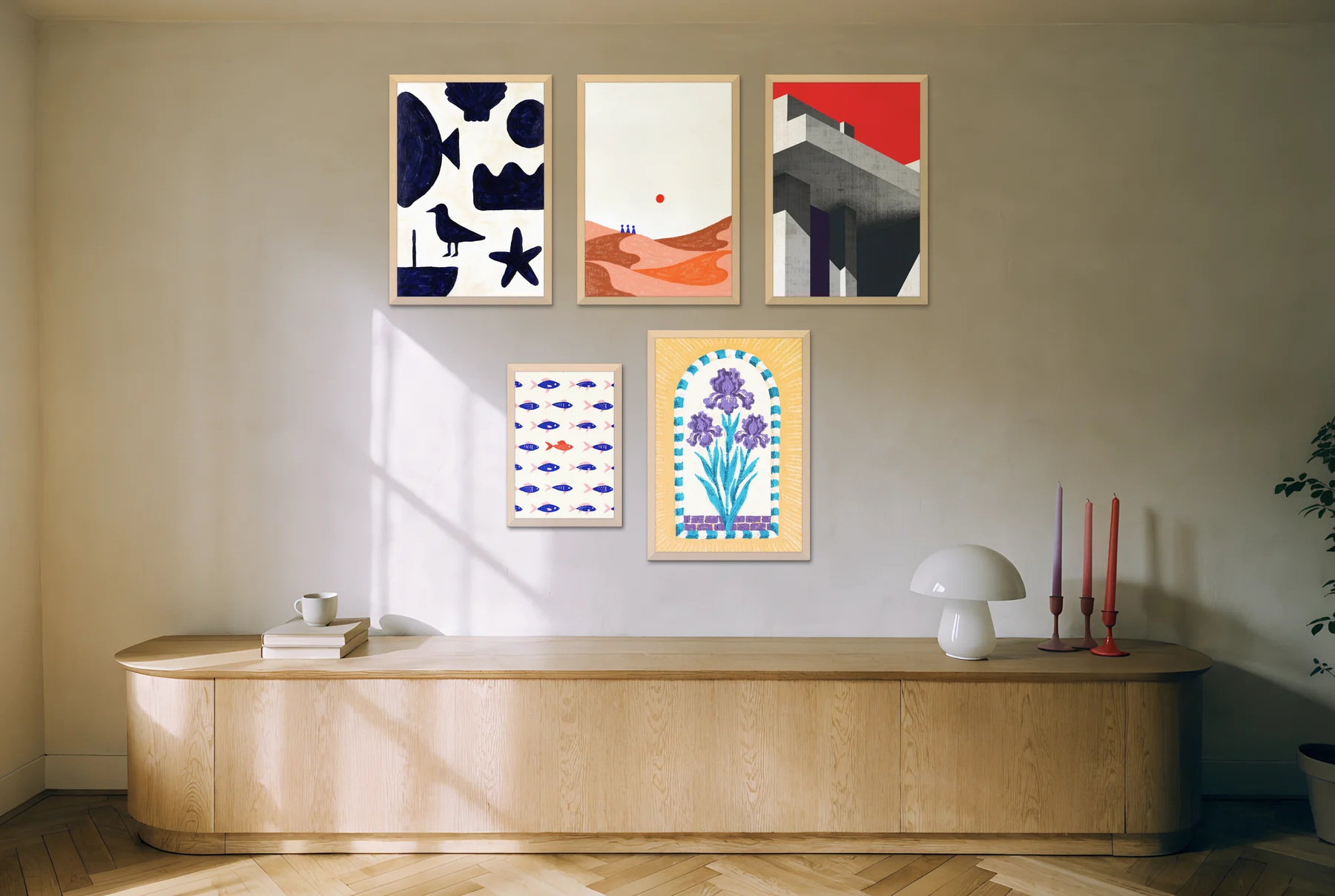 A renter-friendly gallery wall of mixed frames above a long oak sideboard