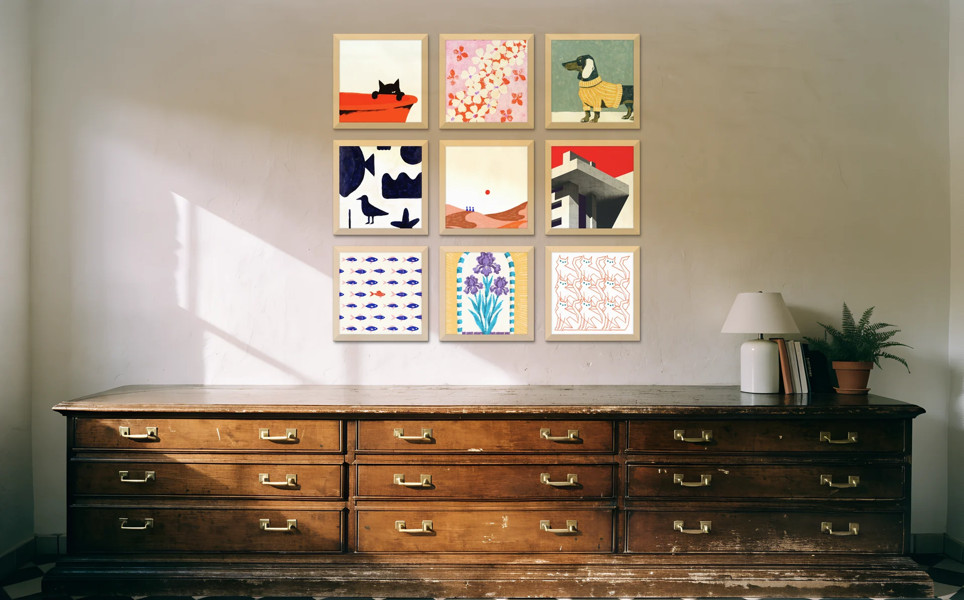 A three by three grid of square frames above a vintage plan chest