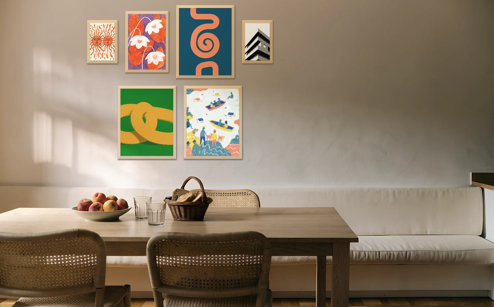 A small salon gallery wall in a kitchen diner above a banquette