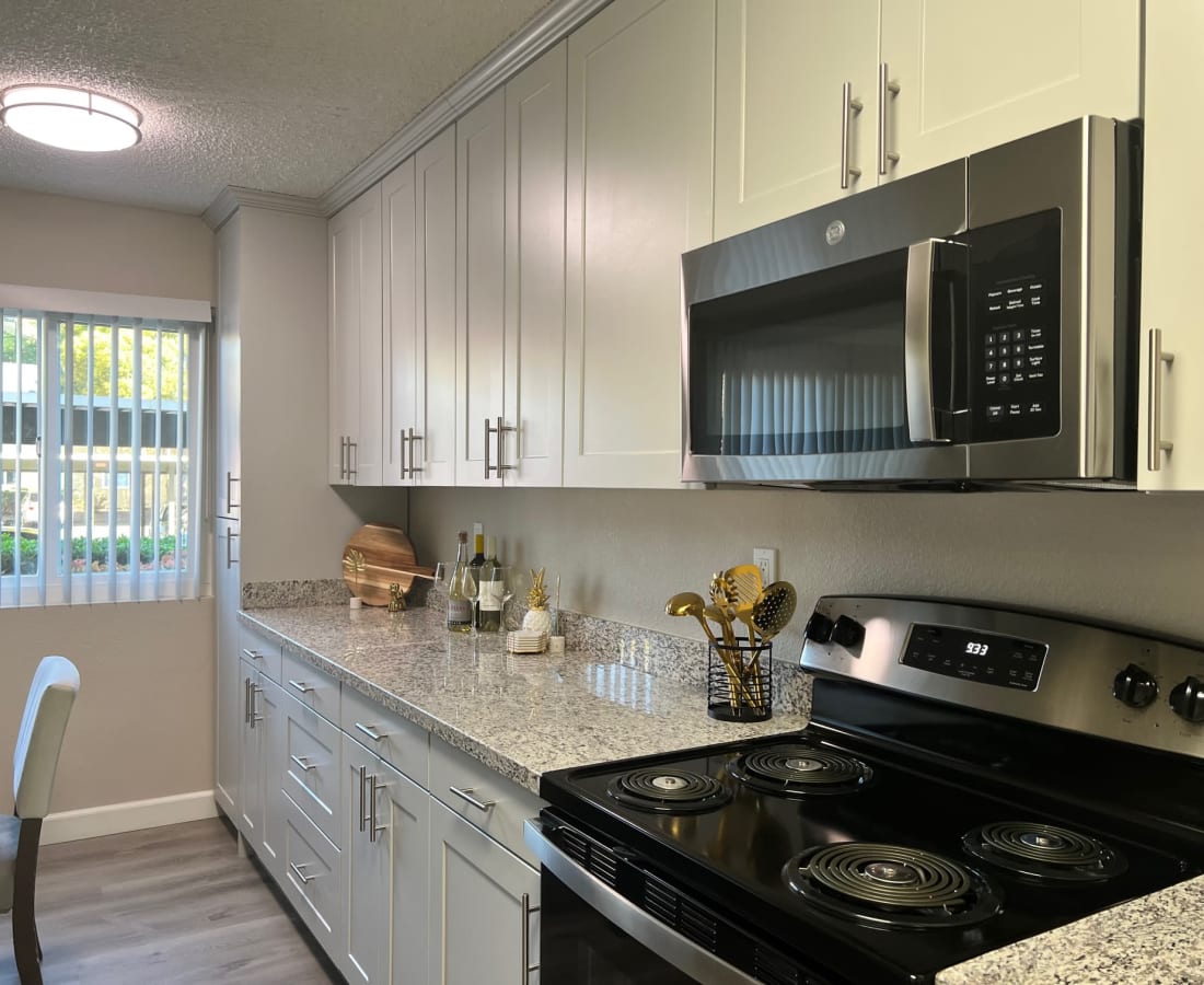 Kitchen with white cabinets and stainless steel appliances
