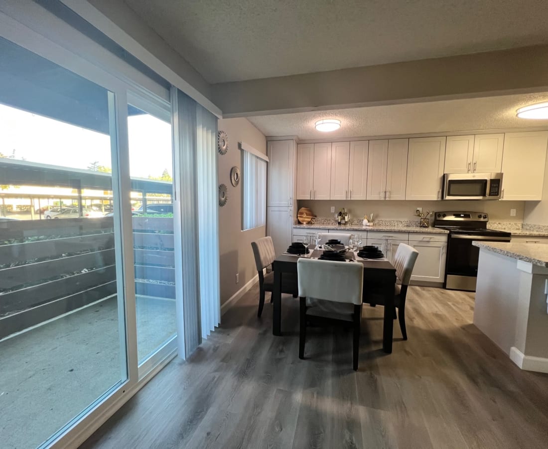 View of dining area and balcony doors