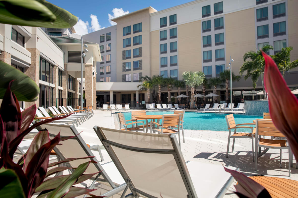 outdoor pool area with greenery