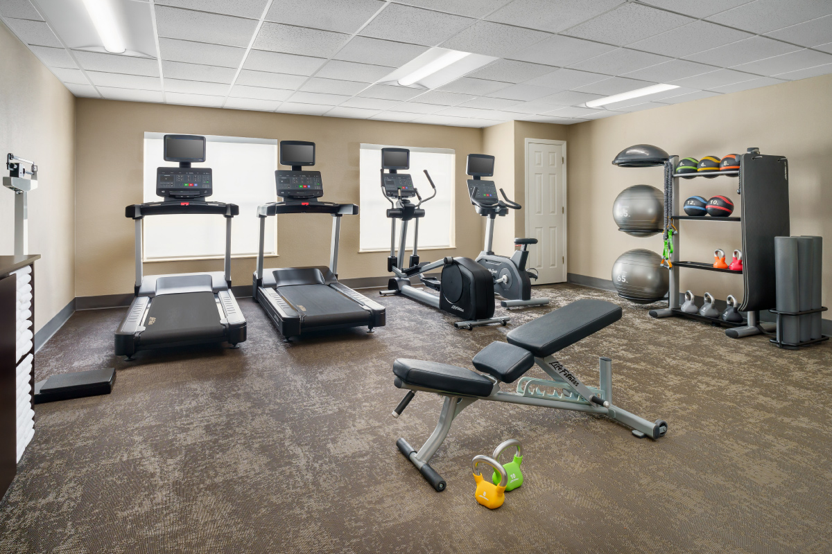 hotel gym with treadmills and fitness equipment