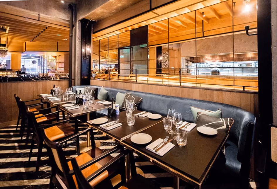 Set tables and banquette seating at Isabelle's