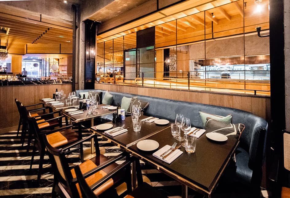 Set tables and banquette seating at Isabelle's