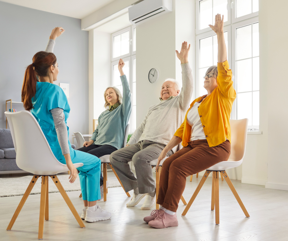 Seniors in a chair-based wellness exercise class