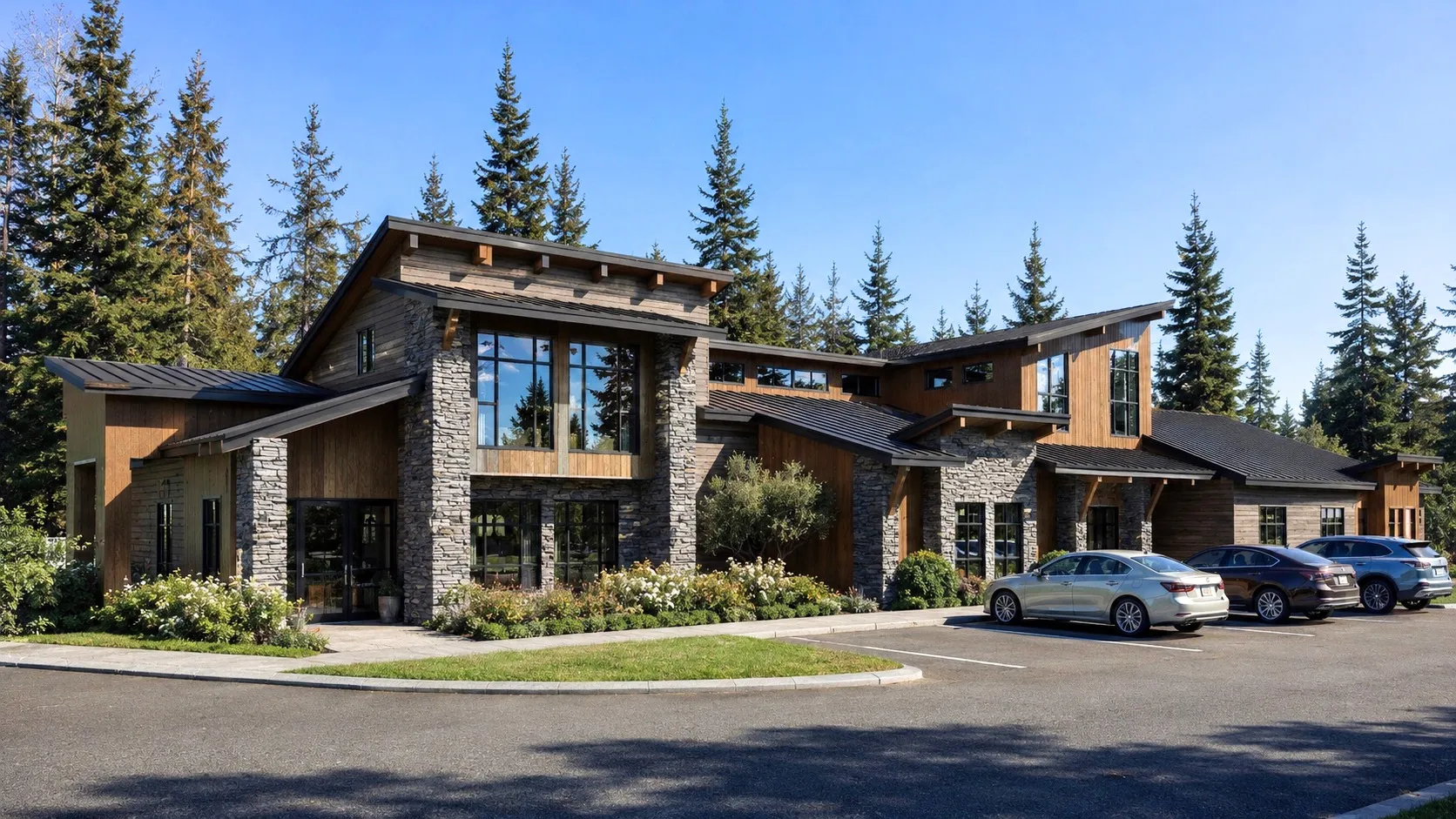 The Hemmingson Coeur d'Alene clubhouse of warm wood and stone framed by evergreens