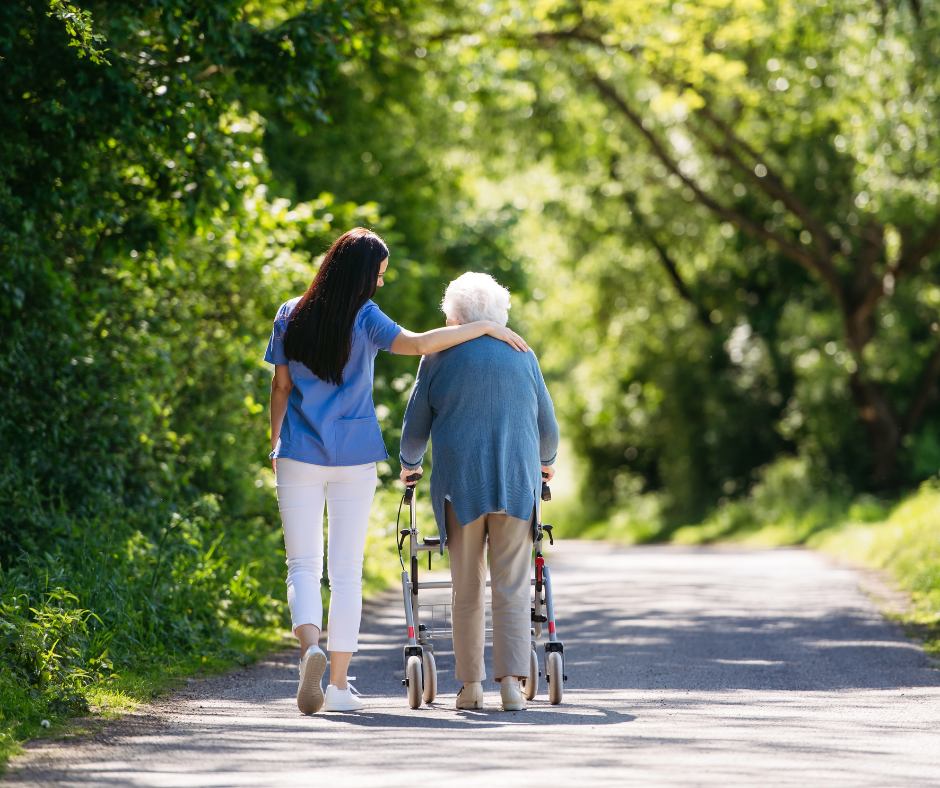 A resident and caregiver sharing a calm moment outdoors