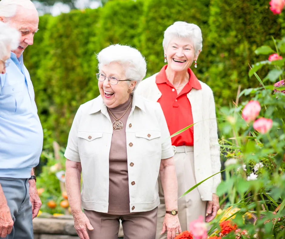 Residents laughing together in a garden