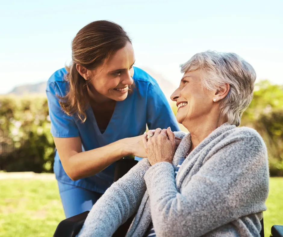 A caregiver supporting a resident with warmth