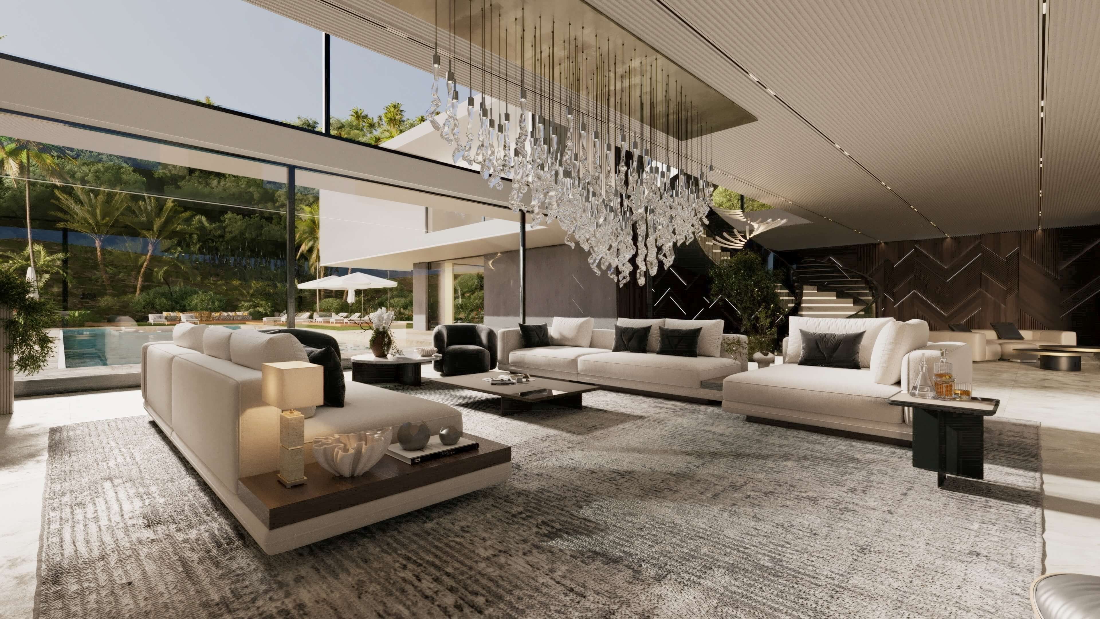 Spacious modern living room with large beige sofas, black cushions, a textured rug, glass coffee tables, a unique hanging glass chandelier, and floor-to-ceiling windows overlooking a pool and outdoor greenery.