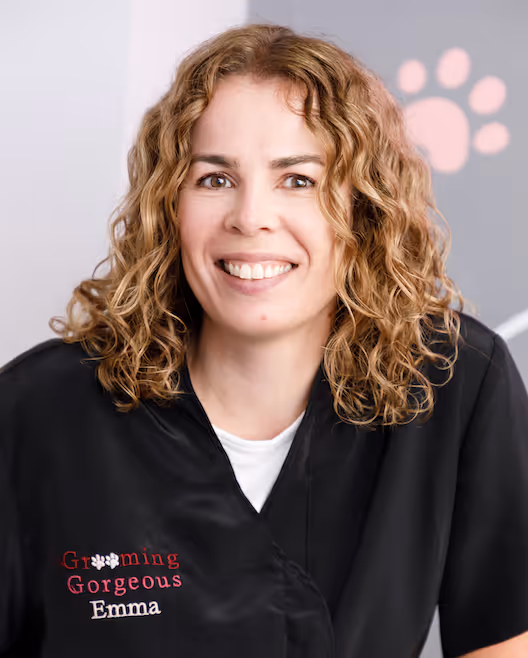 Emma, a groomer at Grooming Gorgeous, in branded uniform