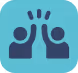 Joyful scene of two people holding hands while one gives the other a celebratory high five.