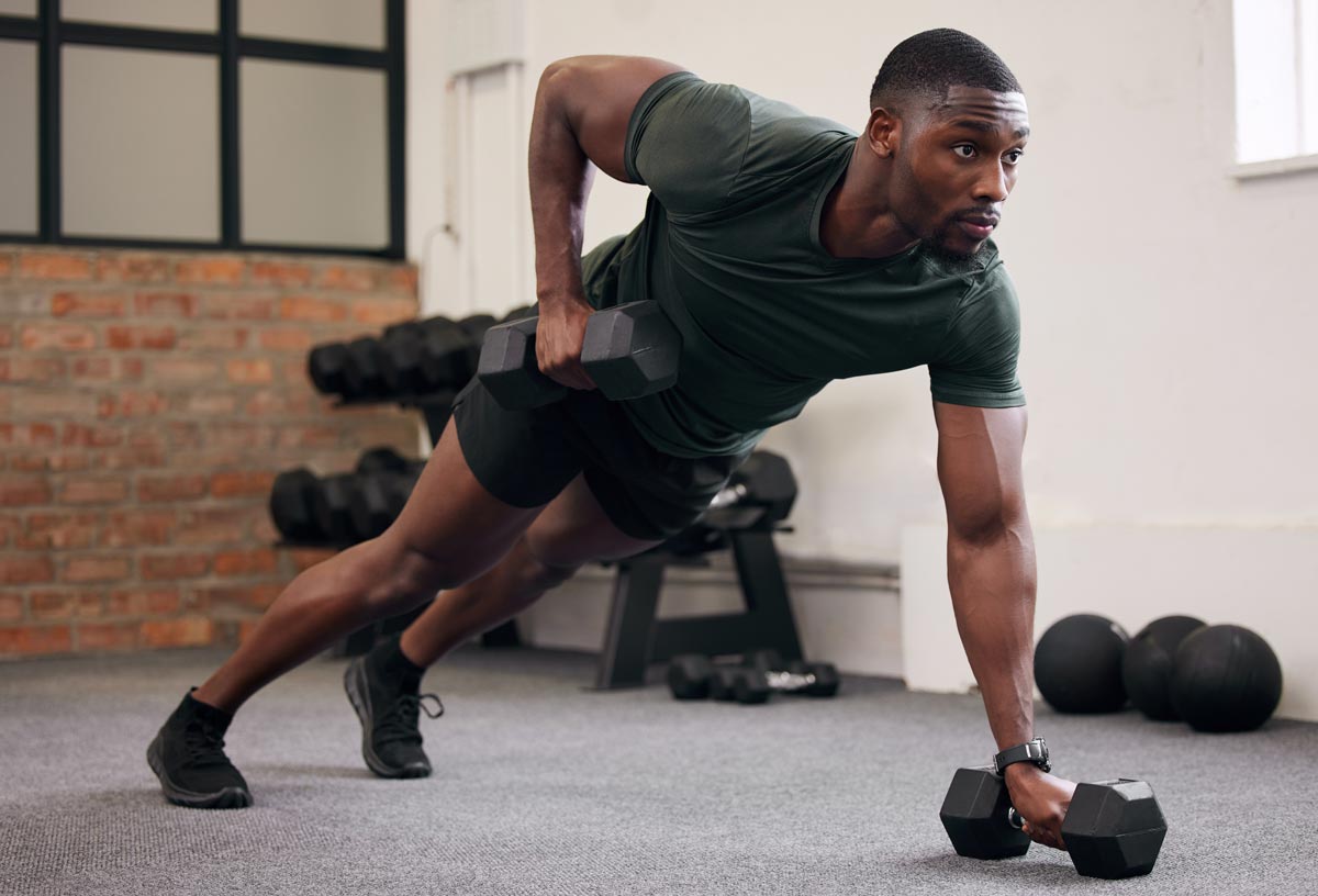 Man performing strength training exercises for fat loss, muscle building, metabolism support, and healthy weight management.