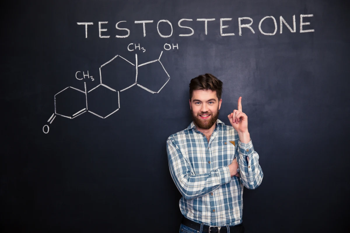 Man pointing to a testosterone diagram representing the relationship between hormones, metabolism, body fat, testosterone levels, and weight management in men.
