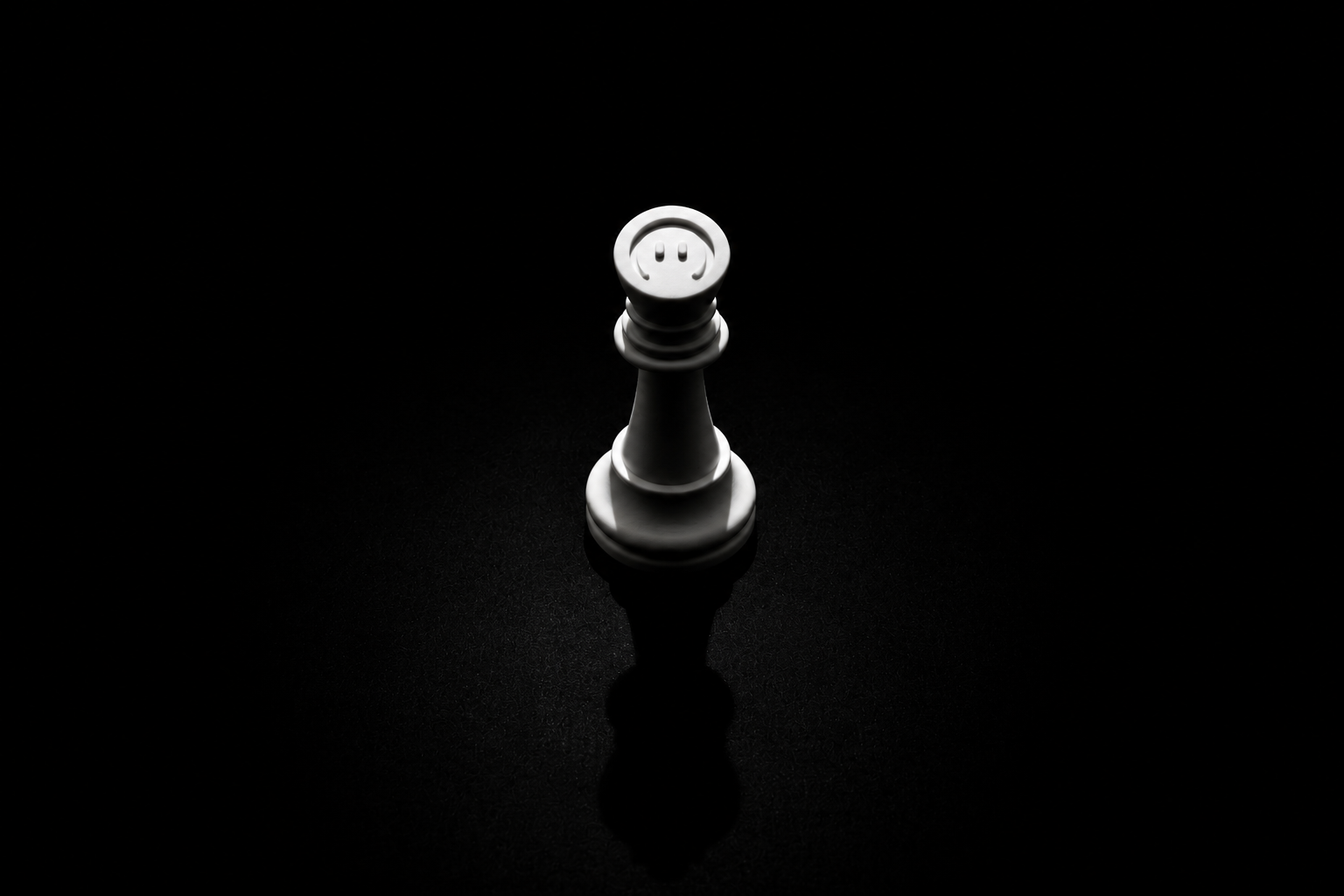 White chess king piece illuminated against a black background casting a shadow below.