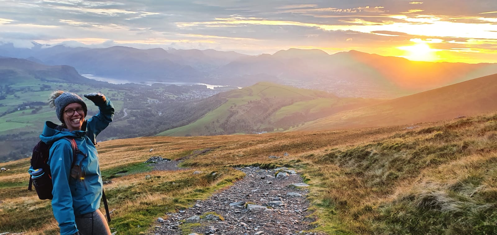 Claire Kokelaar on a mountain path at sunrise